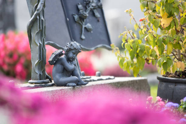 Iron angel on a grave at a cemetery